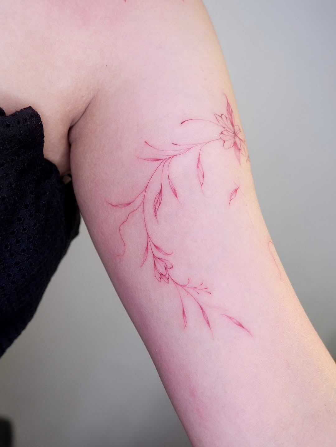 Red-ink freehanded floral — close-up detail