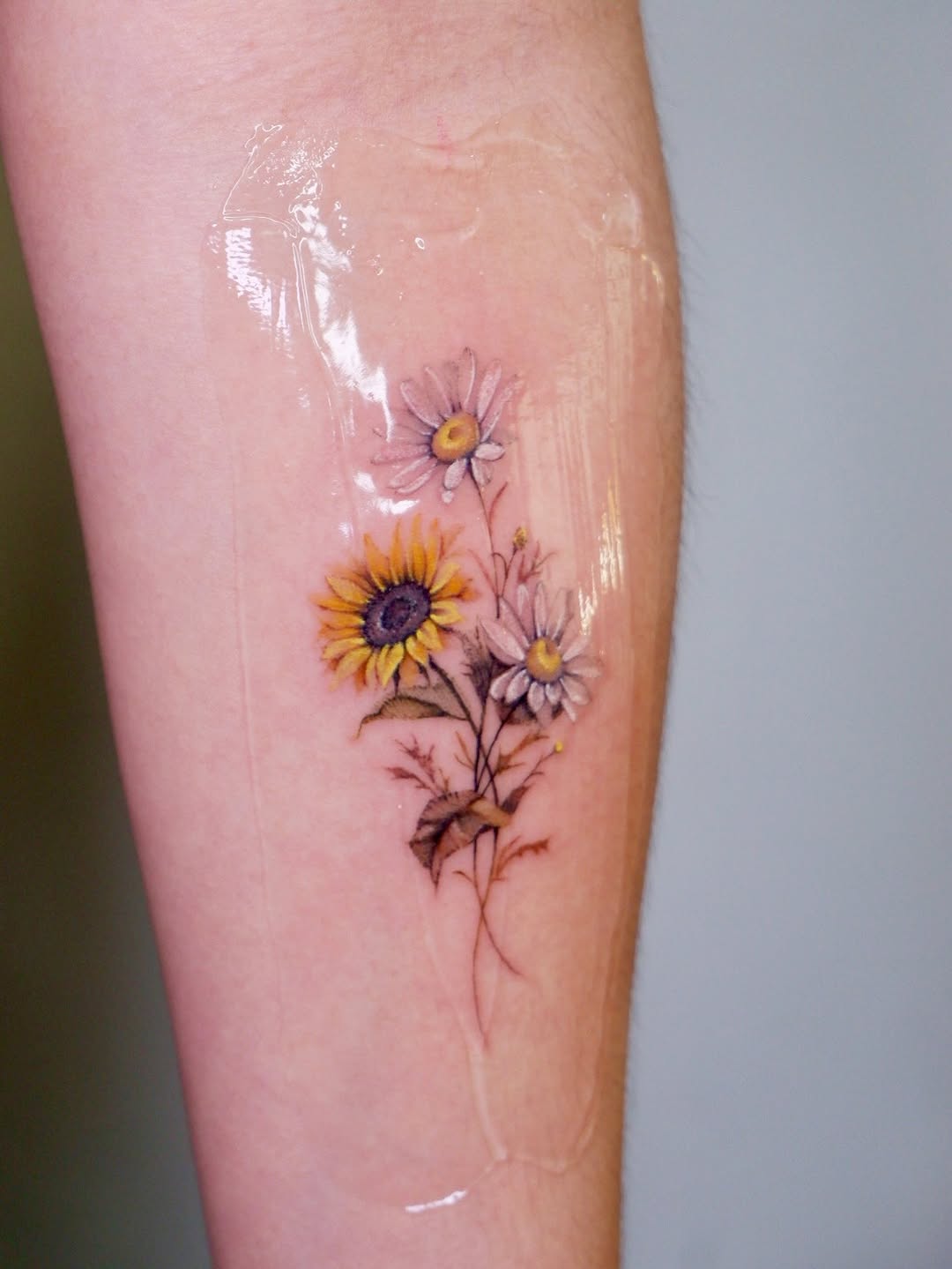 Permanent flowers fine line tattoo